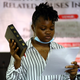 Youth member Rinu Oduala, swears by the Bible, during a judicial panel investigating police brutality and the shooting of protesters in Lagos, Nigeria Oct. 27, 2020.